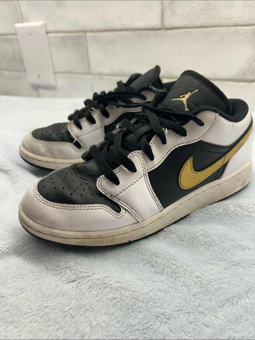 Nike Jordan Kids Low-Top Sneakers in Black, White & Gold Accent